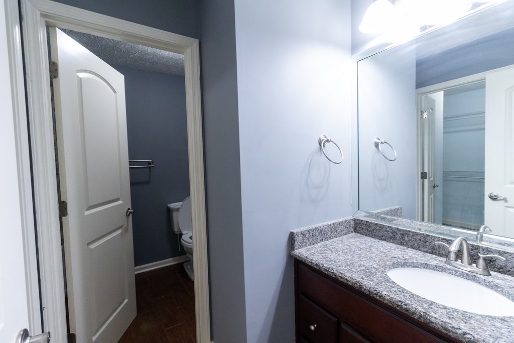 2525 Norris Road, Unit 36 Columbus, GA 31907 - Photo 16 of 28 a bathroom with a granite countertop sink and a mirror