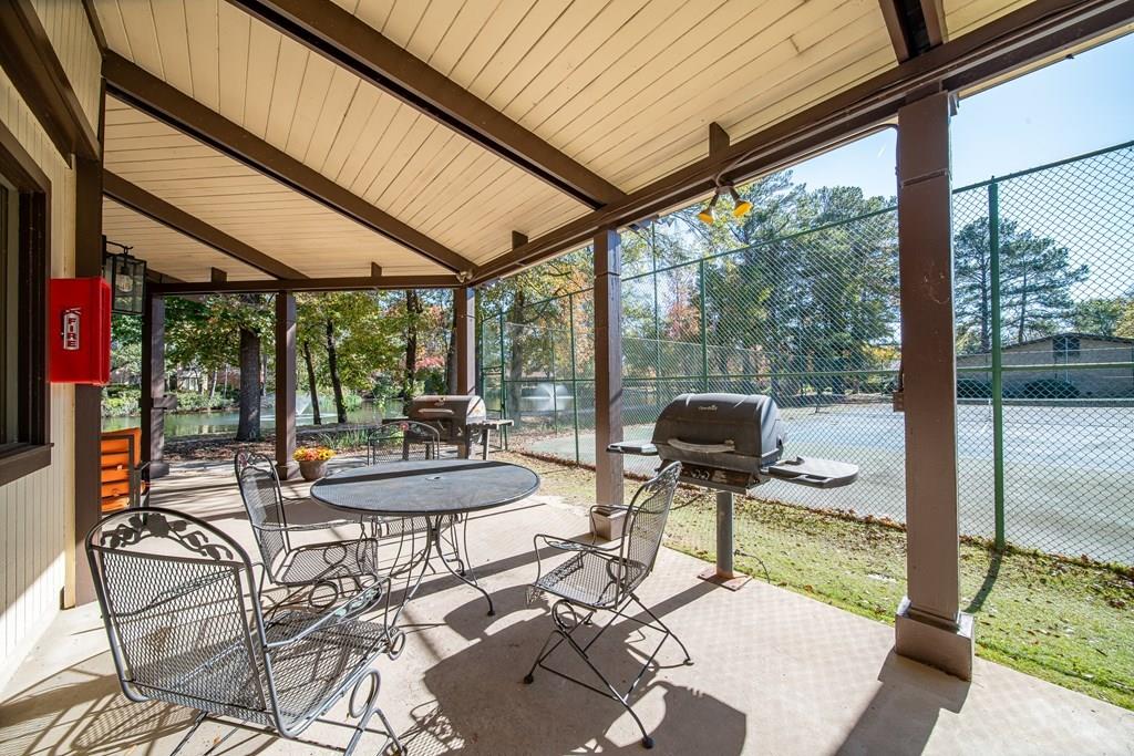 2525 Norris Road, Unit 36 Columbus, GA 31907 - Photo 27 of 28 a view of a patio with a dining table and chairs