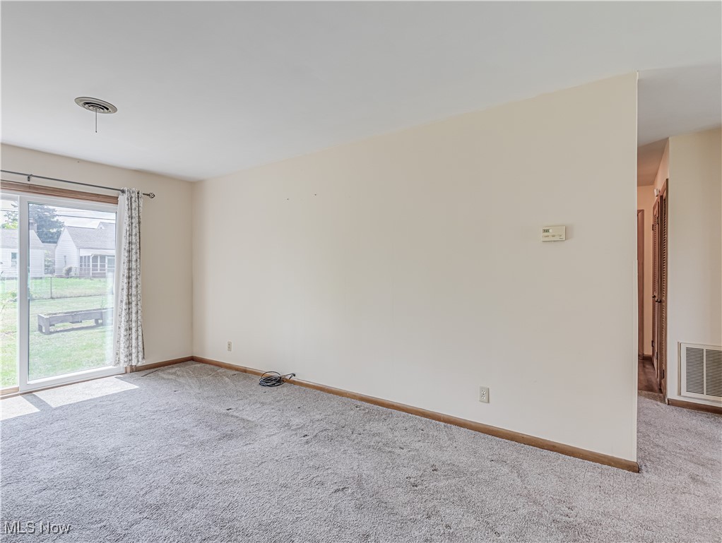 1014 Lilly Road Alliance, OH 44601 - Photo 4 of 19 View of carpeted empty room