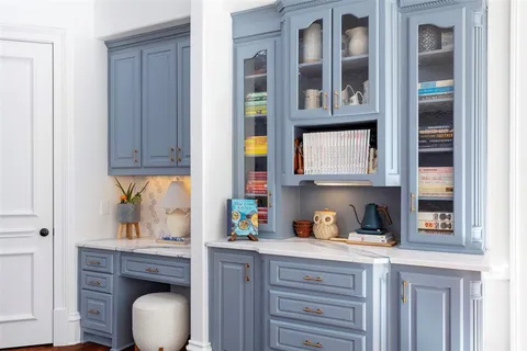 a kitchen with stainless steel appliances granite countertop a sink and cabinets