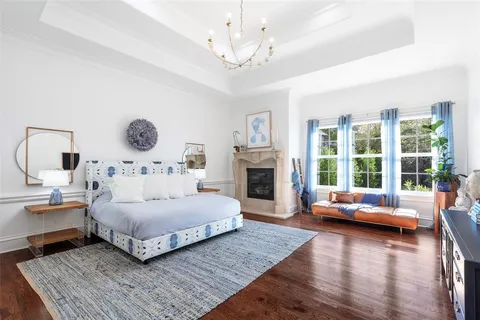 a bedroom with a large bed and a couch