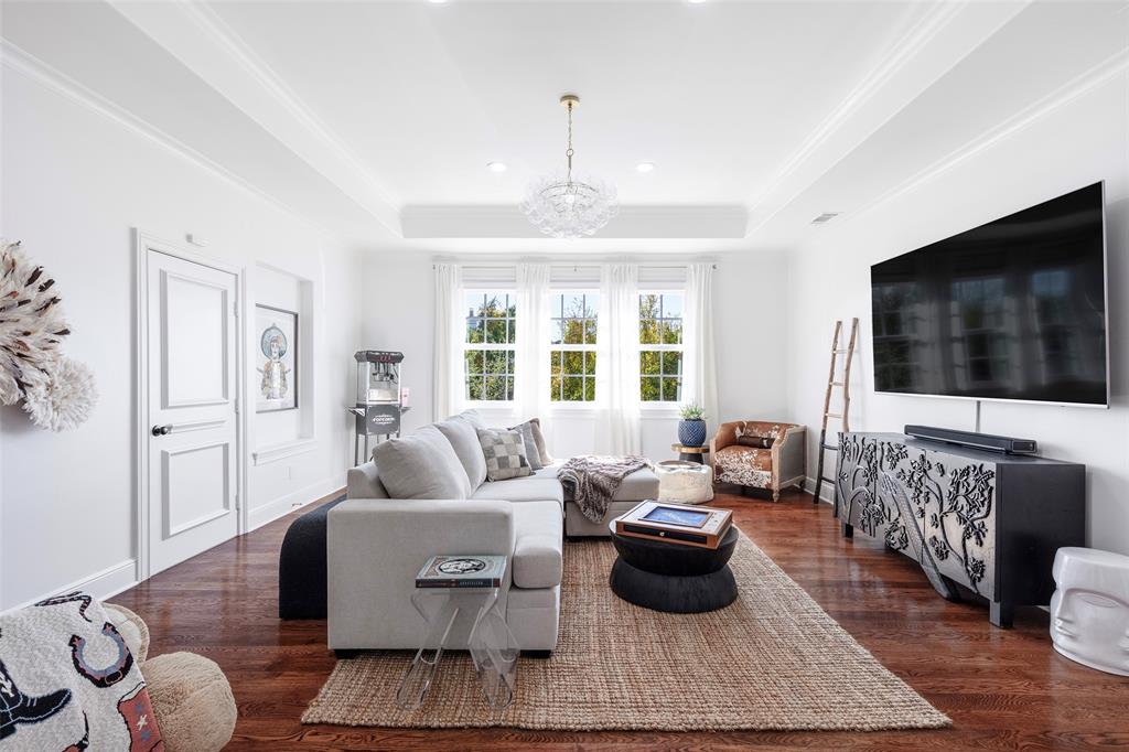 6401 St Michael Drive McKinney, TX 75072 - Photo 23 of 34 a living room with furniture and a flat screen tv