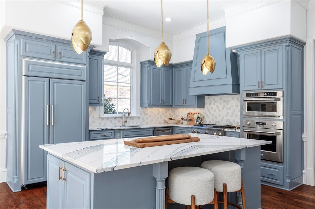 6401 St Michael Drive McKinney, TX 75072 - Photo 3 of 34 a kitchen with a sink cabinets and window