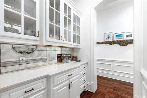a view of a kitchen sink and a refrigerator