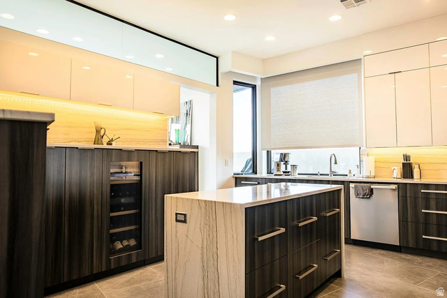 1500 Split Rock, Unit 150 Ivins, UT 84738 - Photo 10 of 14 Contemporary kitchen featuring a waterfall island, integrated wine cooler, stainless steel appliances, modern cabinetry, and recessed lighting