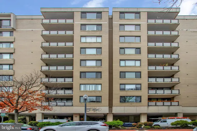 a front view of a building with a lot of windows