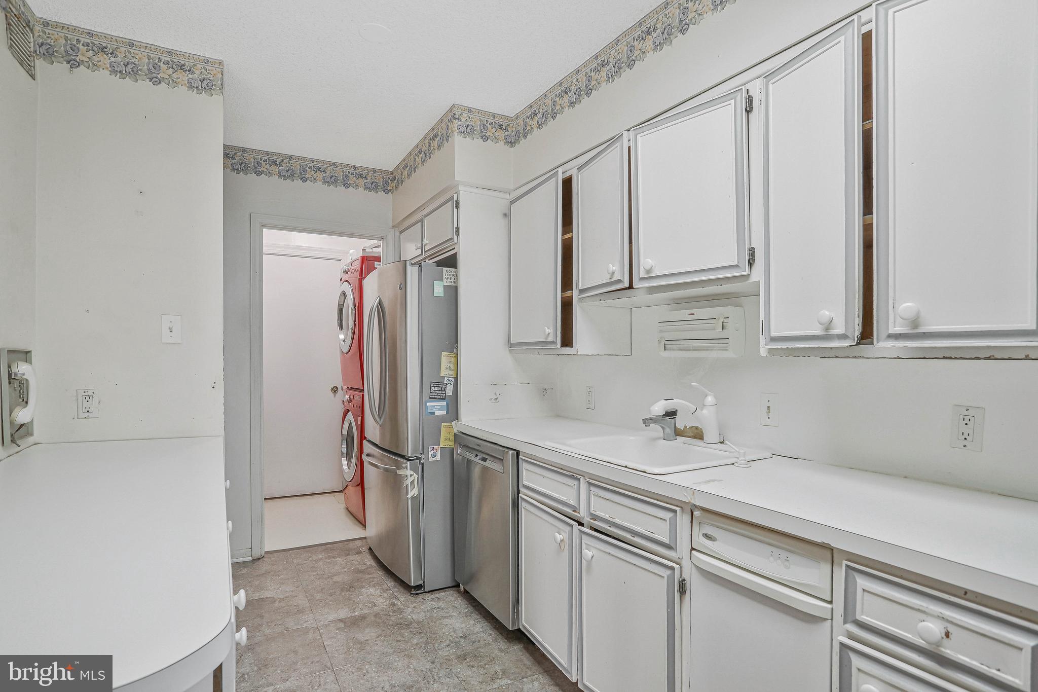 800 25th Street Northwest, Unit 502 Washington, DC 20037 - Photo 13 of 48 a kitchen with a sink and refrigerator