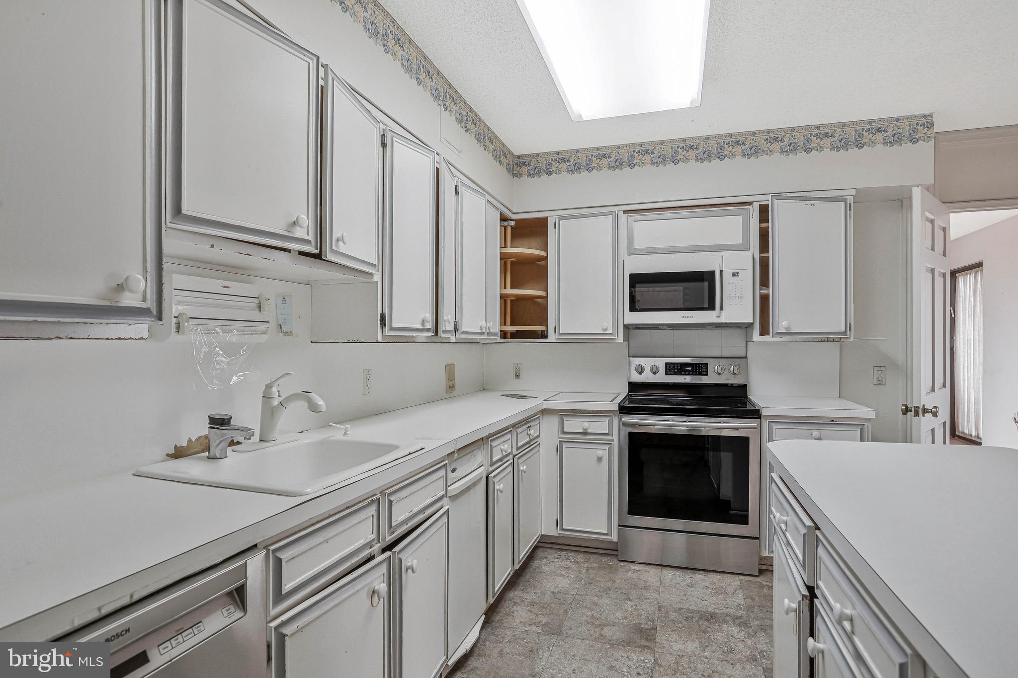 800 25th Street Northwest, Unit 502 Washington, DC 20037 - Photo 15 of 48 a kitchen with a sink stove and microwave