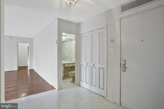 wooden floor with white walls