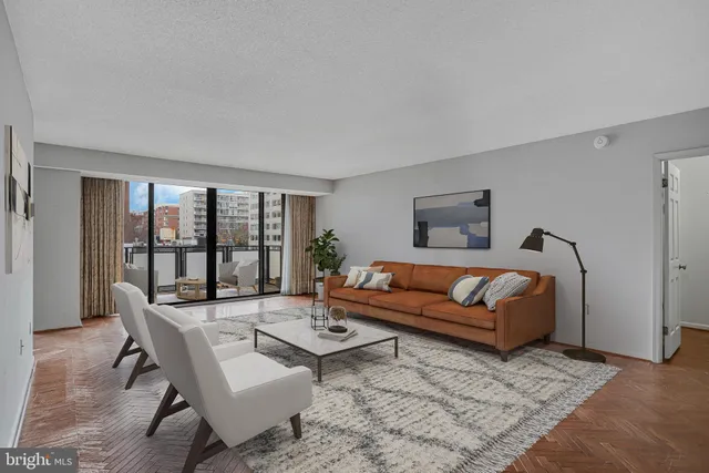a living room with furniture and a table
