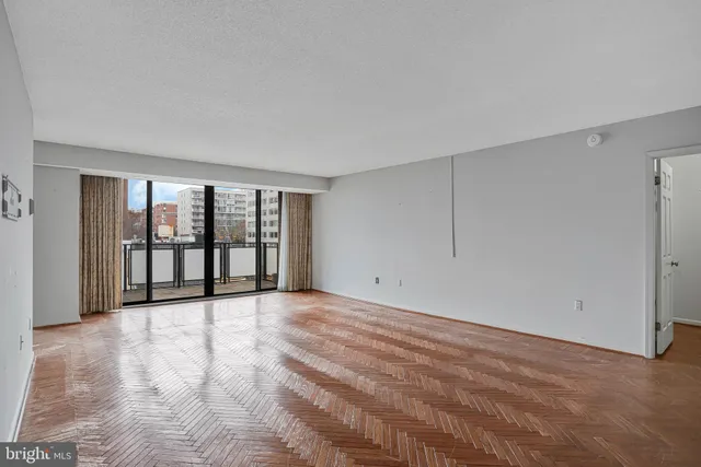 a view of an empty room with a window