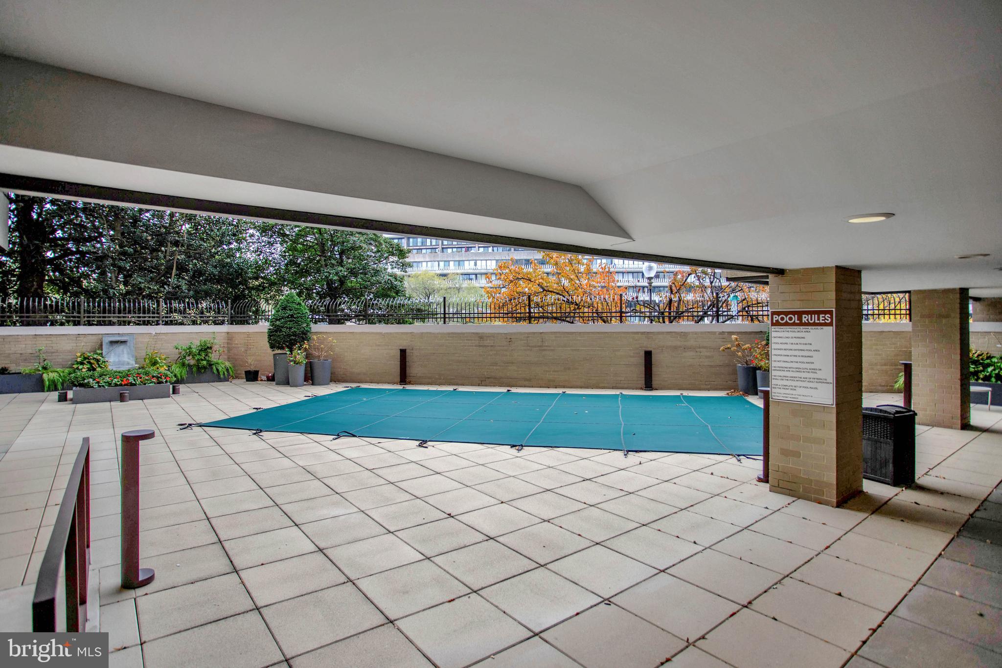 800 25th Street Northwest, Unit 502 Washington, DC 20037 - Photo 43 of 48 a kitchen with stainless steel appliances kitchen island granite countertop a refrigerator and a stove