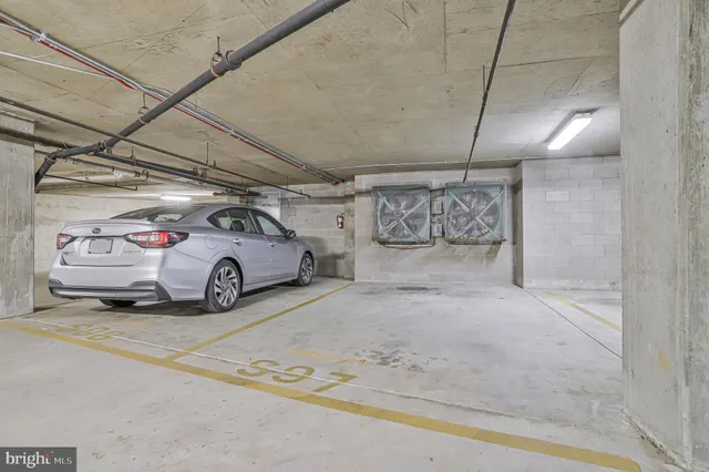 a view of a big room with furniture and large windows