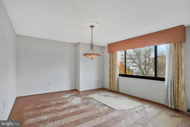 a view of a room with a large window