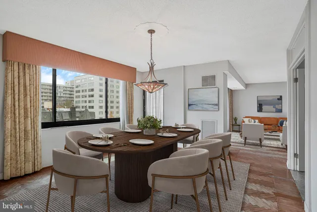 a view of a dining room with furniture window and outside view