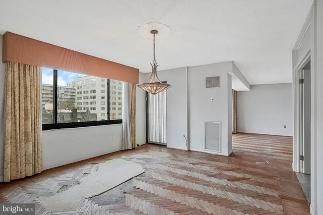 a view of an empty room with a window