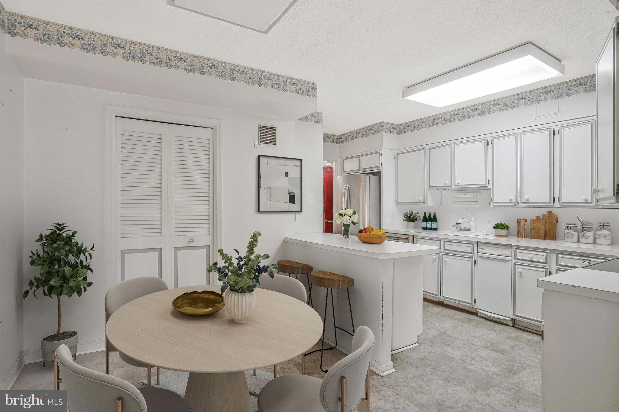 800 25th Street Northwest, Unit 502 Washington, DC 20037 - Photo 10 of 48 a kitchen with stainless steel appliances a sink and white cabinets