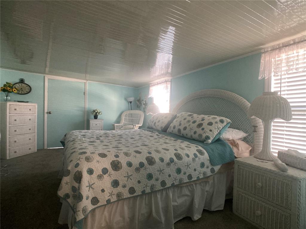 1710 7th Street Southwest, Unit 27 Ruskin, FL 33570 - Photo 12 of 26 a bedroom with a bed and window