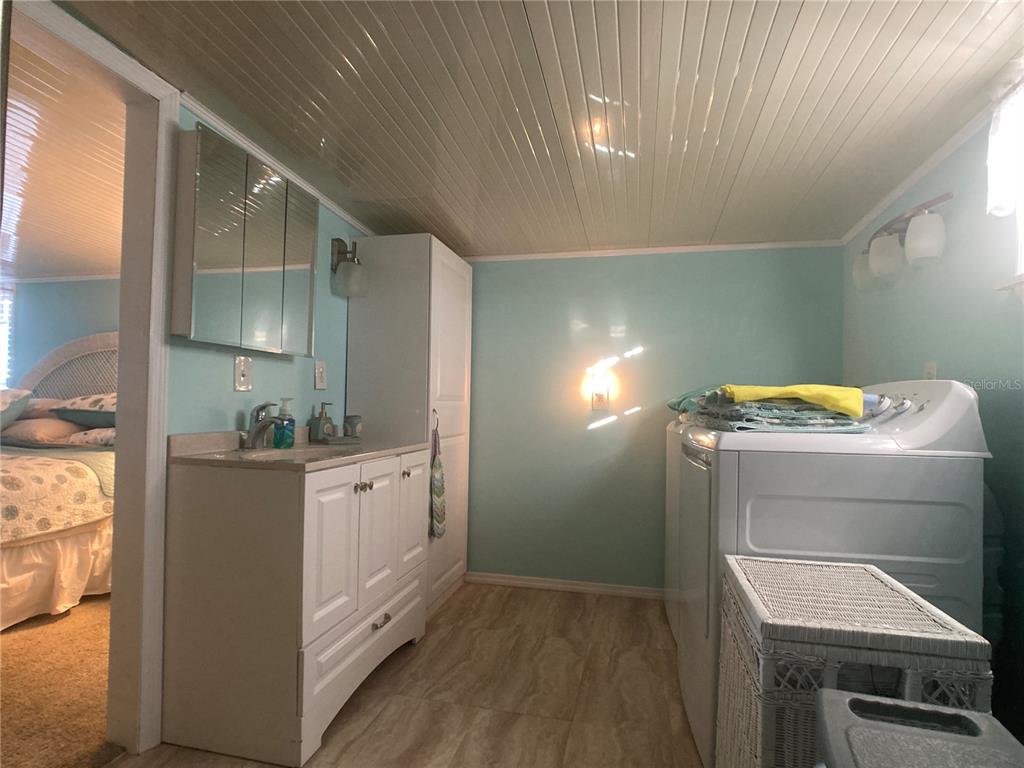 1710 7th Street Southwest, Unit 27 Ruskin, FL 33570 - Photo 14 of 26 a room with storage and utility