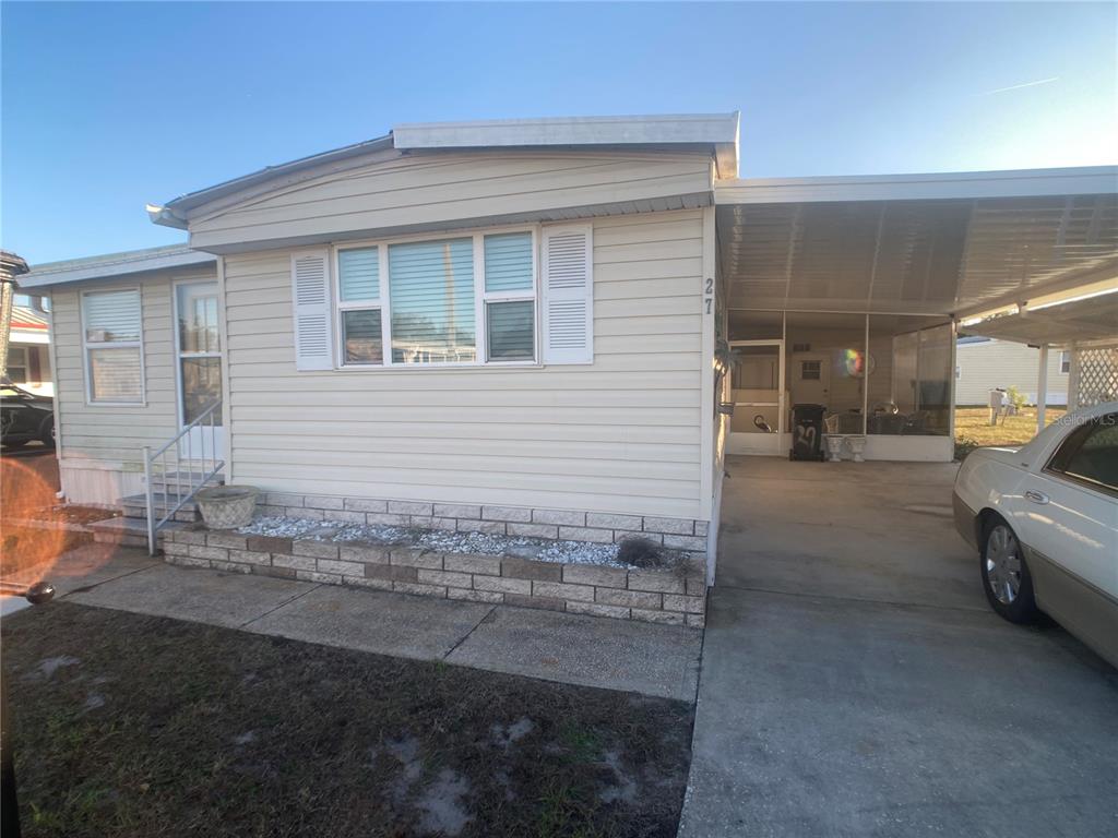 1710 7th Street Southwest, Unit 27 Ruskin, FL 33570 - Photo 2 of 26 a view of a car garage