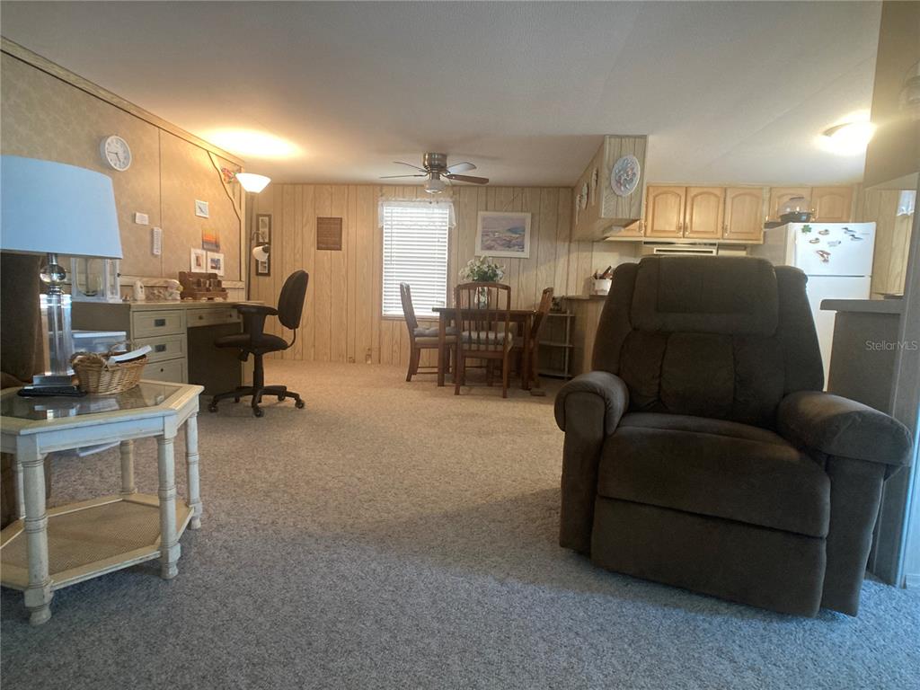 1710 7th Street Southwest, Unit 27 Ruskin, FL 33570 - Photo 5 of 26 a living room with furniture and a piano