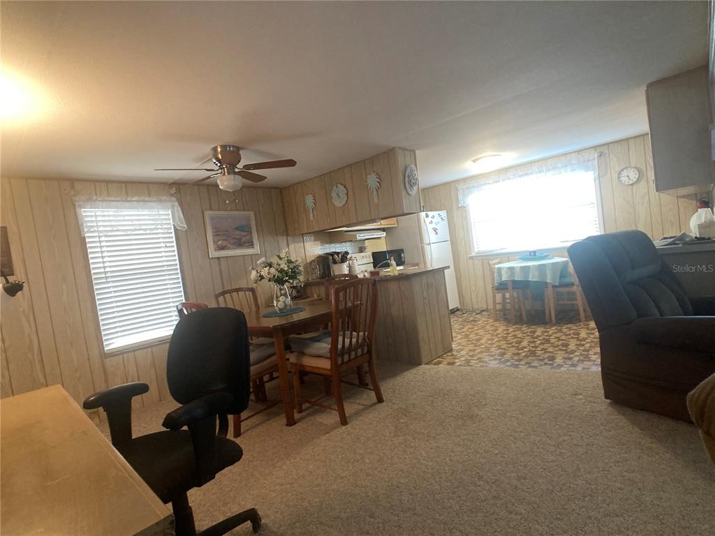 1710 7th Street Southwest, Unit 27 Ruskin, FL 33570 - Photo 6 of 26 a view of a workspace with furniture and a window