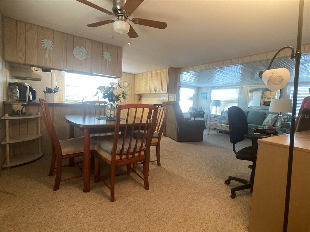 1710 7th Street Southwest, Unit 27 Ruskin, FL 33570 - Photo 7 of 26 a dining room with furniture and window