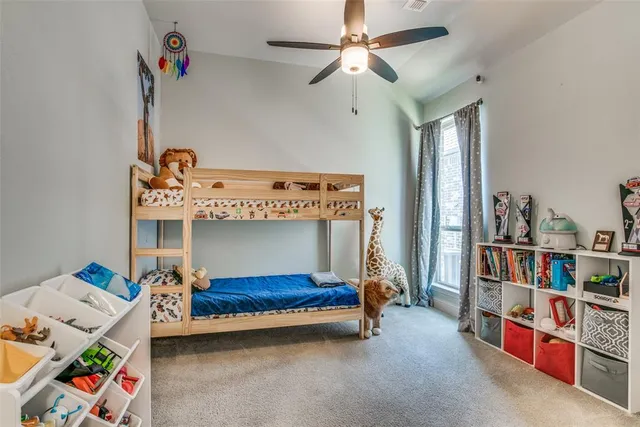 a bathroom with a sink a toilet and shower curtain