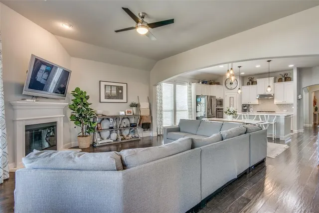 a living room with furniture and a fireplace