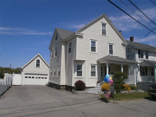 25 Barnes Street Waltham, MA 02453 - Photo 2 of 12 a view of a house with a patio and a yard