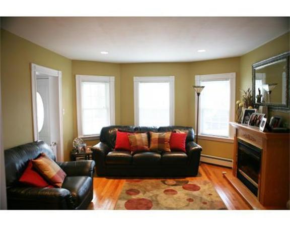 25 Barnes Street Waltham, MA 02453 - Photo 3 of 12 a living room with furniture a flat screen tv and a couch