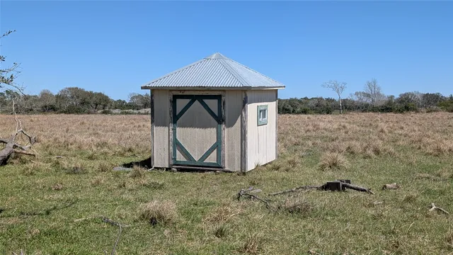 a small pool is sitting in the middle of a lake