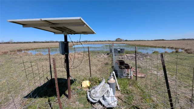 a view of a swimming pool with a chair