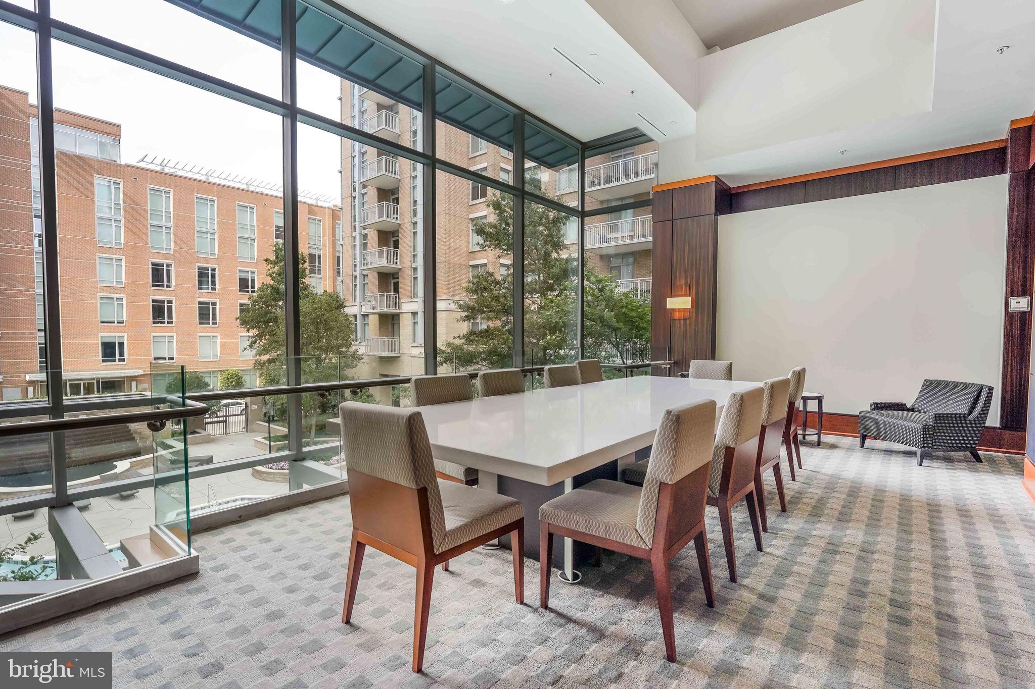 11990 Market Street, Unit 413 Reston, VA 20190 - Photo 45 of 82 a view of a dining room with furniture window and wooden floor