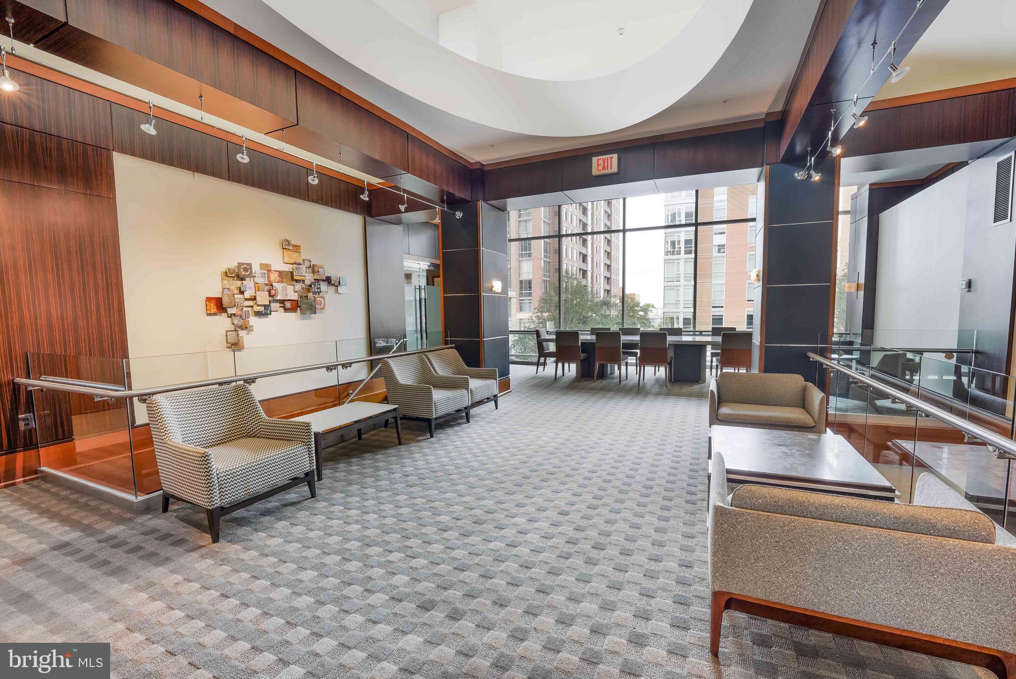 11990 Market Street, Unit 413 Reston, VA 20190 - Photo 52 of 82 a living room with furniture and a large window