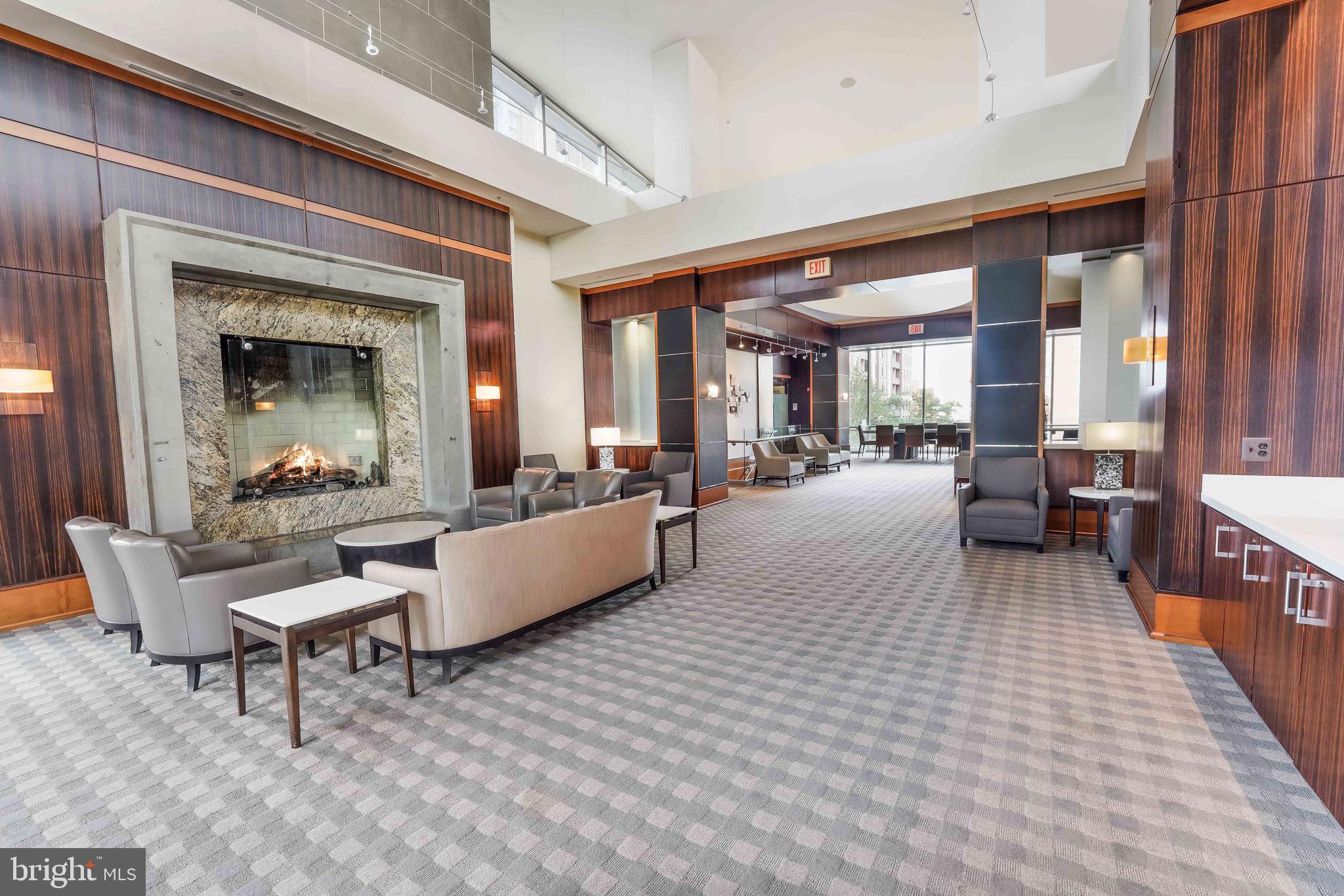 11990 Market Street, Unit 413 Reston, VA 20190 - Photo 53 of 82 a living room with furniture and a large window