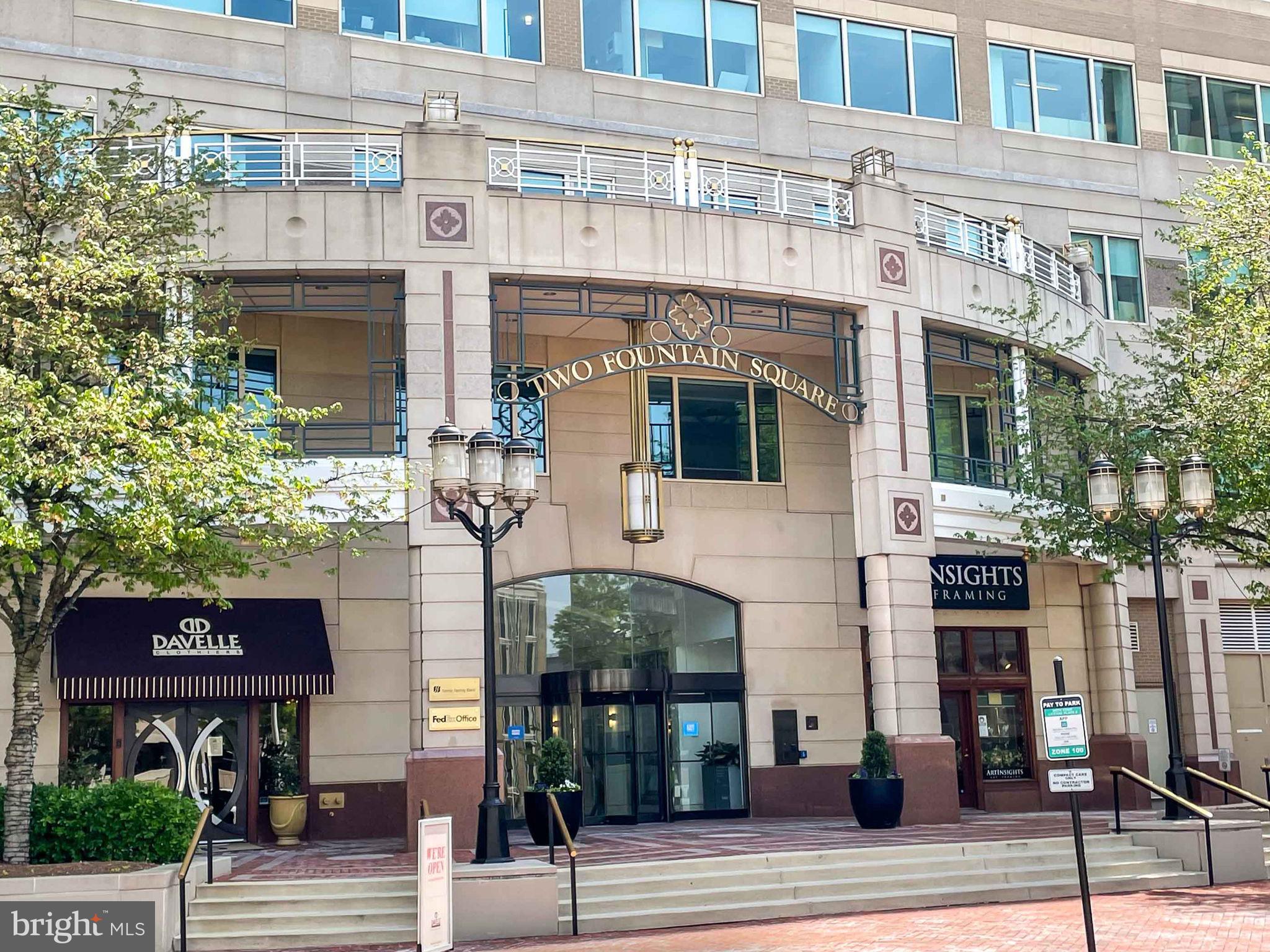 11990 Market Street, Unit 413 Reston, VA 20190 - Photo 60 of 82 a front view of a building and car parked