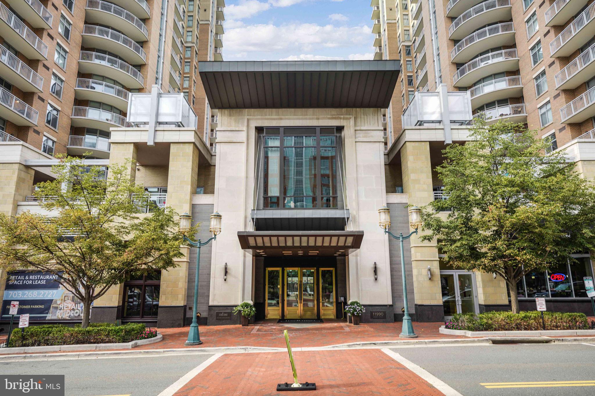 11990 Market Street, Unit 413 Reston, VA 20190 - Photo 70 of 82 front view of a building with a street