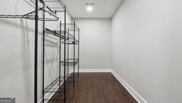 a bathroom with a double vanity sink and mirror
