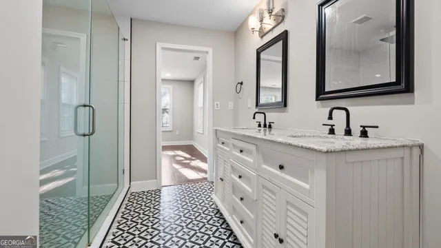 a kitchen with kitchen island granite countertop stainless steel appliances a stove sink and microwave