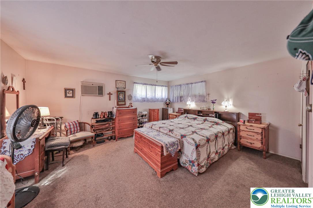 331 Cranberry Creek Road Cresco, PA 18326 - Photo 42 of 95 A comfortable retreat features plush carpeting and a ceiling fan for year-round comfort.