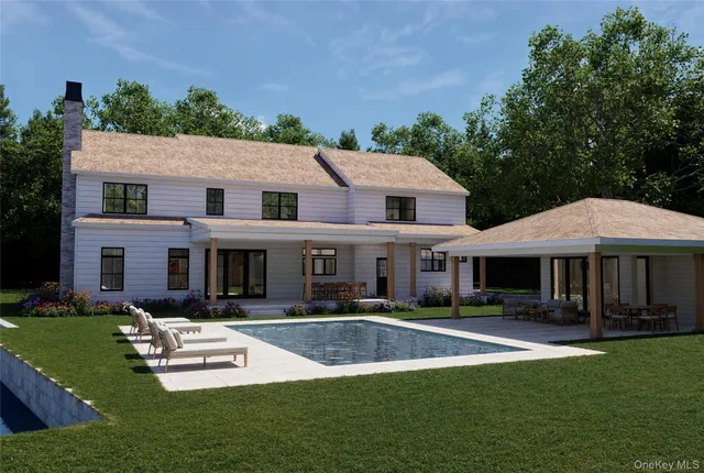 a front view of a house with a yard table and chairs