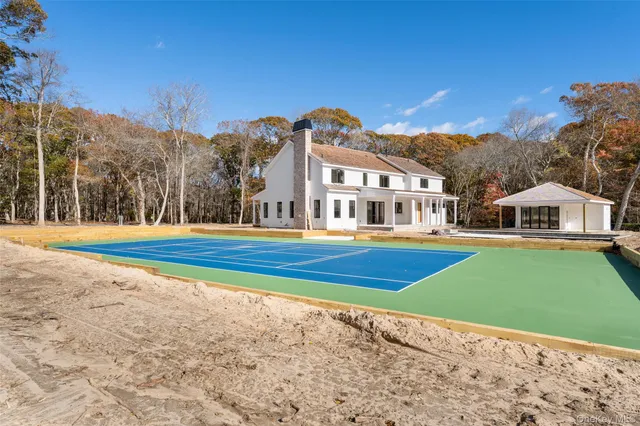 a house with trees in the background