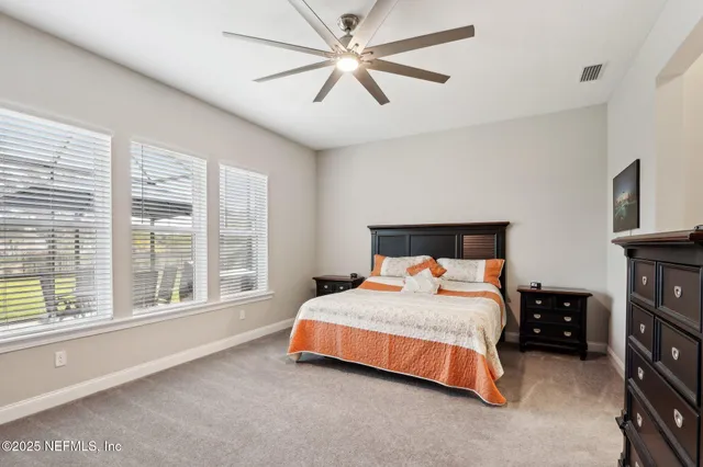 a view of a swimming pool with a yard