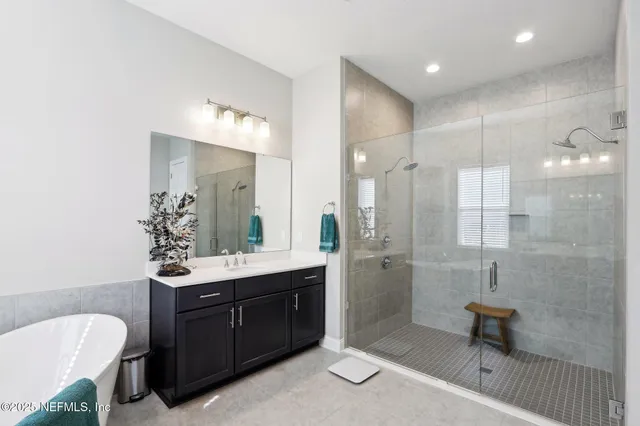 an aerial view of a house with a swimming pool and outdoor space