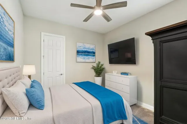 an aerial view of residential houses with outdoor space and lake view