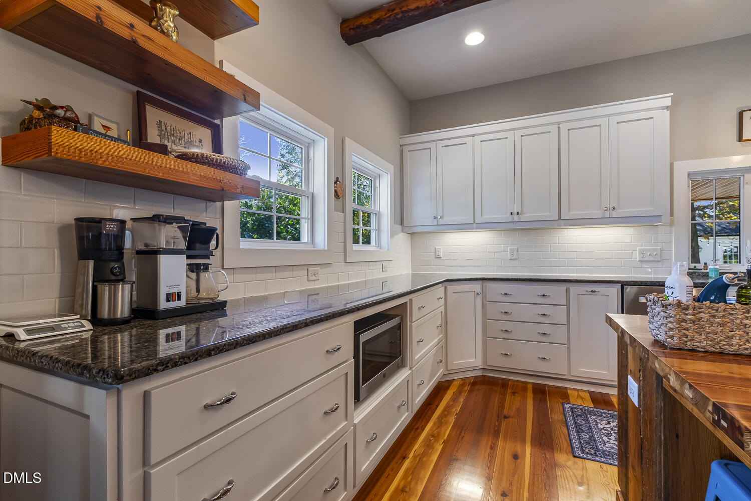 129 Kipling Road Fuquay-Varina, NC 27526 - Photo 14 of 58 a kitchen with granite countertop stainless steel appliances a stove sink and cabinets