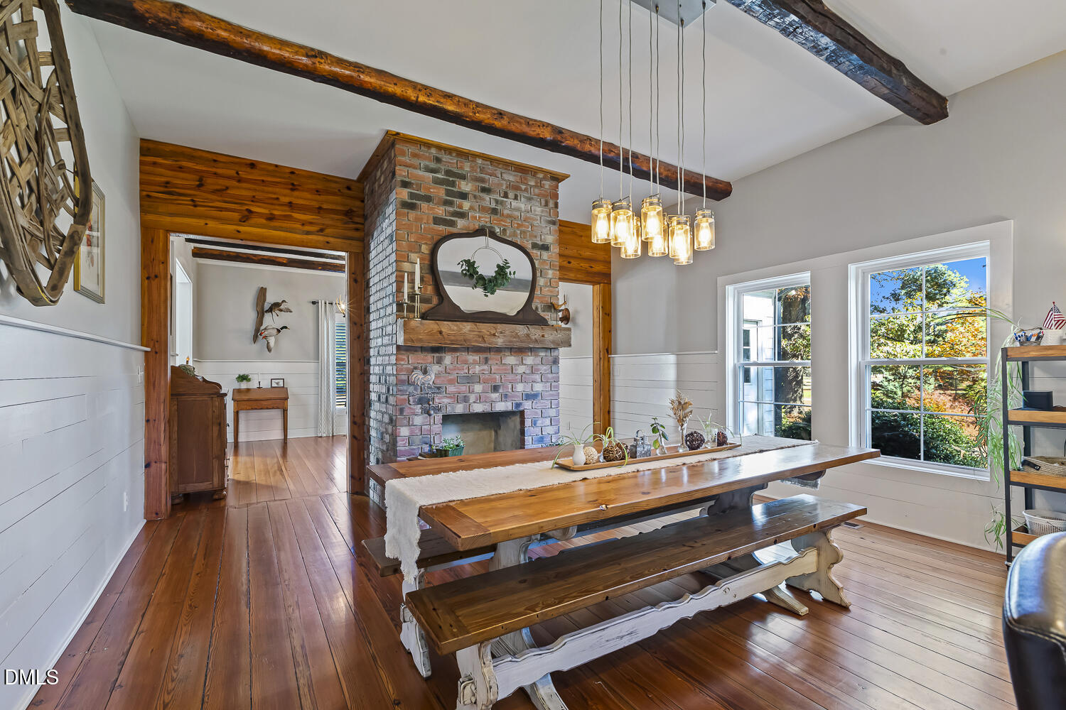 129 Kipling Road Fuquay-Varina, NC 27526 - Photo 16 of 58 a living room with furniture a fireplace and a large window