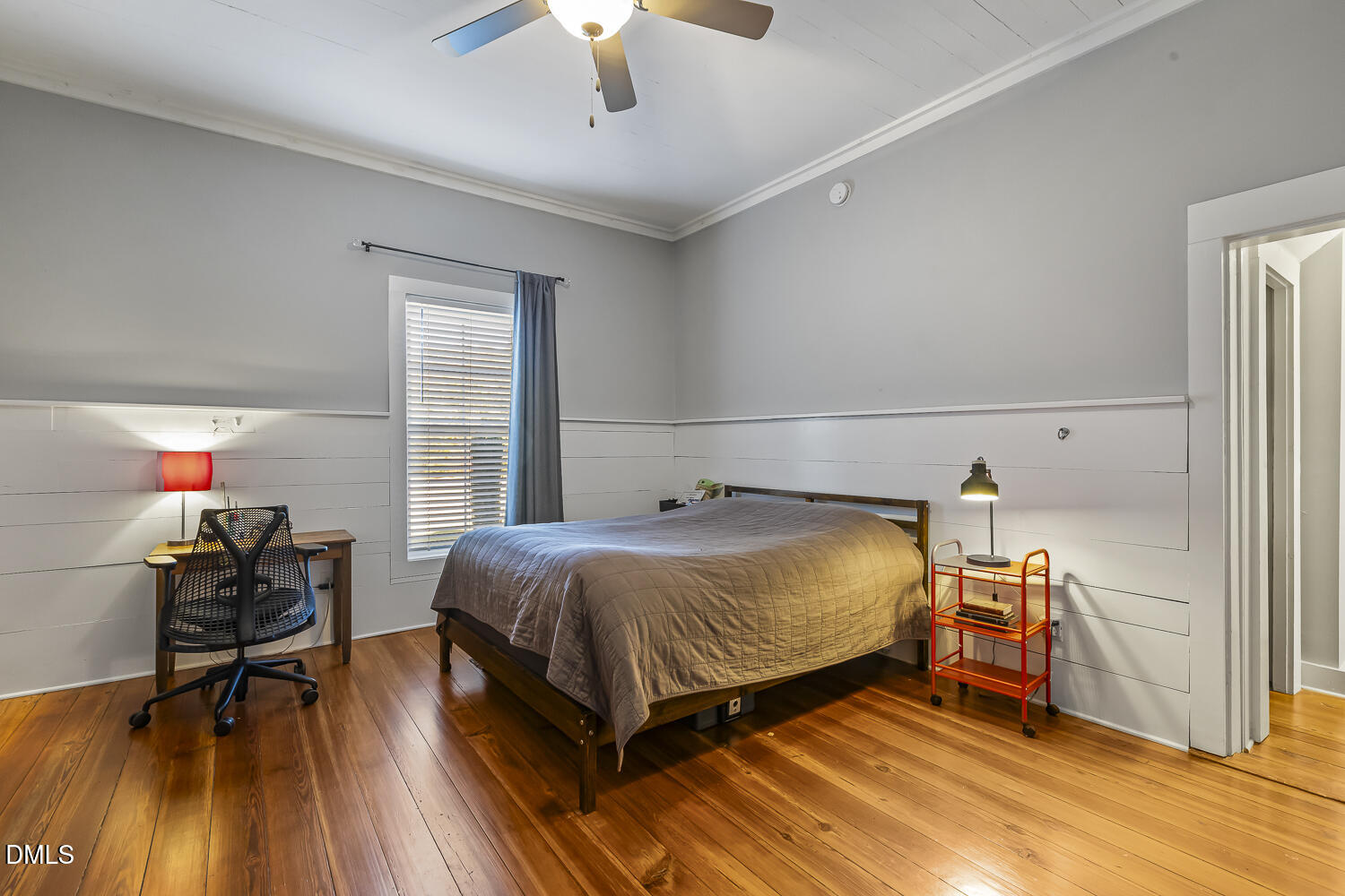 129 Kipling Road Fuquay-Varina, NC 27526 - Photo 29 of 58 a bedroom with a bed and a wooden floor