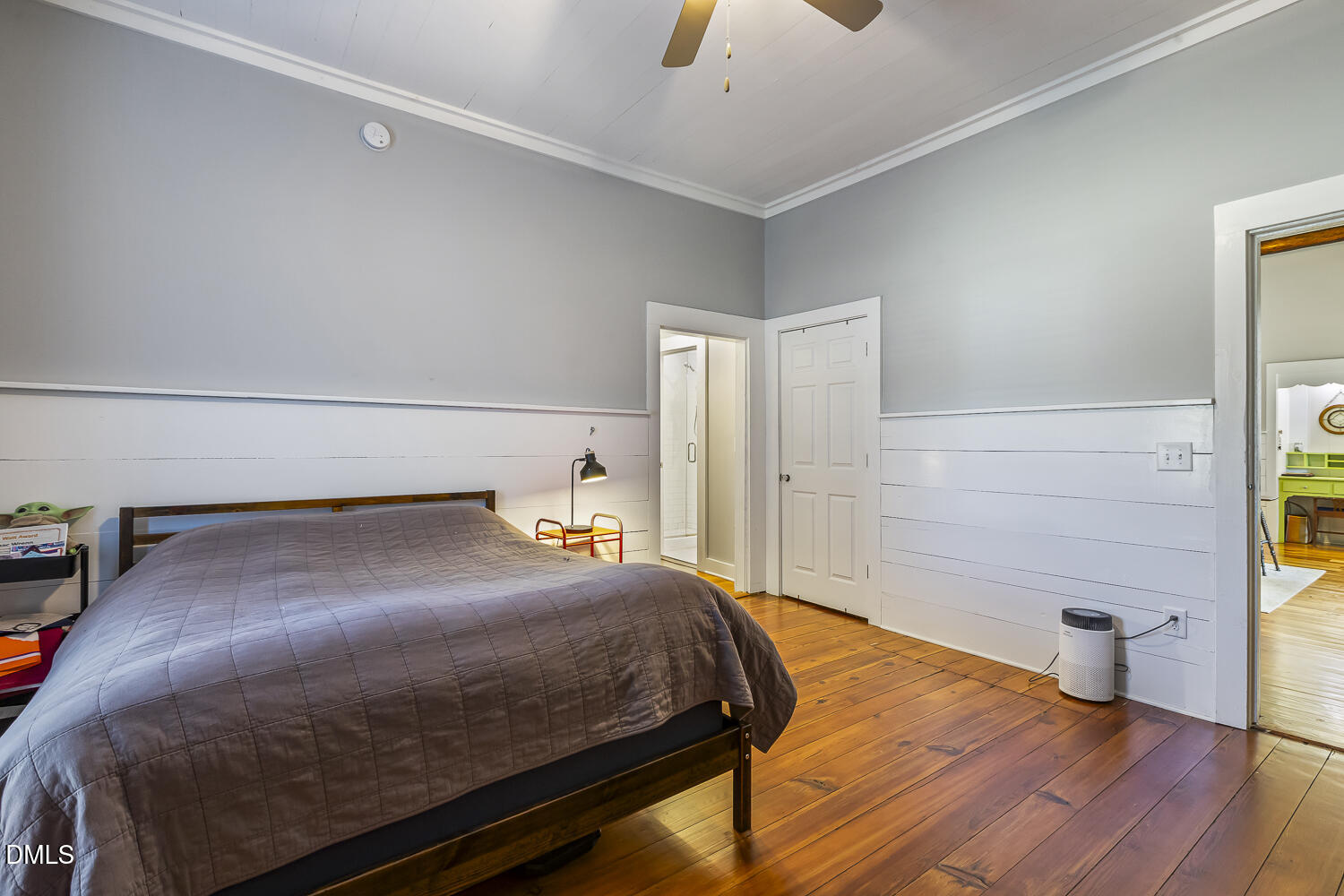 129 Kipling Road Fuquay-Varina, NC 27526 - Photo 30 of 58 a bedroom with a bed and wooden floor